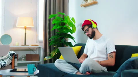 Concentrated serious man working online from the laptop type some information he Stock Footage 156397991