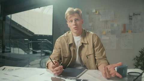 Concentrated Smiling Manager Explaining the Project Looking to the Camera Stock Footage 239109600