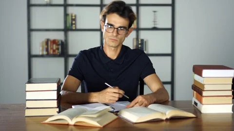 Concentrated student studying at home. Preparing for the university, learning Stock Footage 93279799