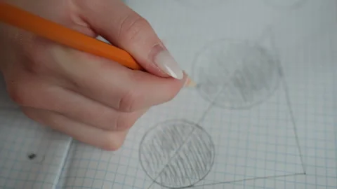 Concentrated student working on mathematics problem set. Student diligently Stock Footage 341976458