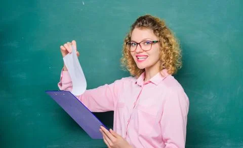 Concentrated on studying. report project. back to school. teacher with document Stock Photos