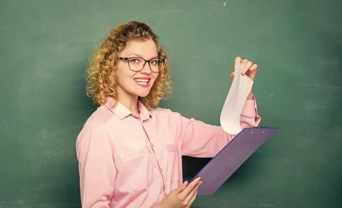 Concentrated on studying. report project. back to school. teacher with document Stock Photos