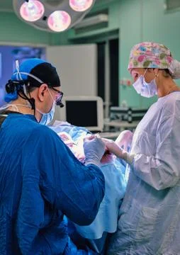 Concentrated surgeon during an operation Stock Photos
