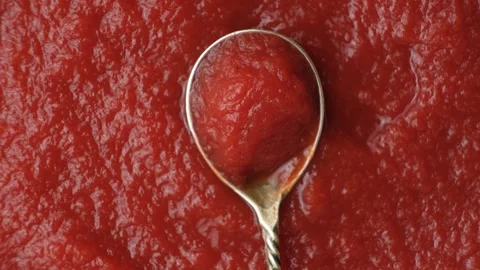 Concentrated Tomato Paste in a Spoon. Top View Rotate Stock Footage 314741327