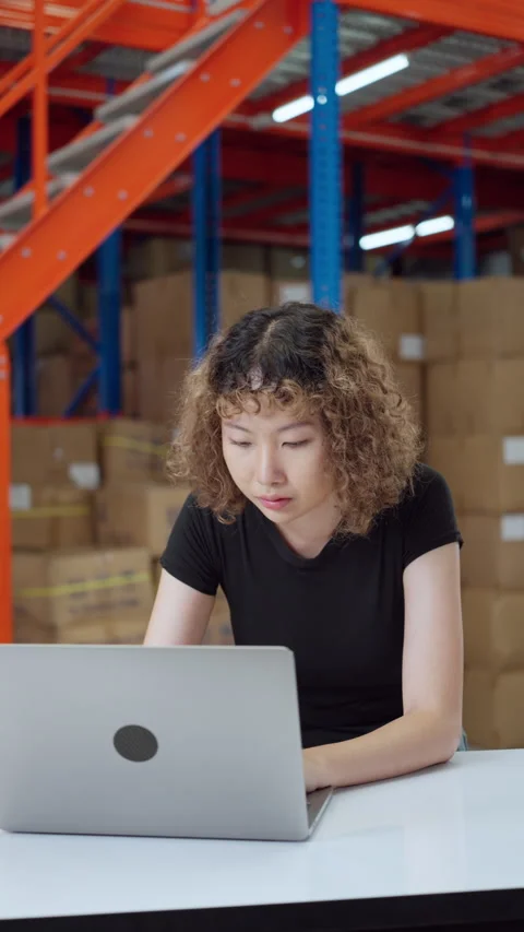 Concentrated Warehouse Worker Using Laptop. Video stock 278429729