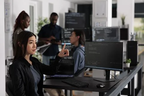 Concentrated web developer working with hologram and coding language Stock Photos