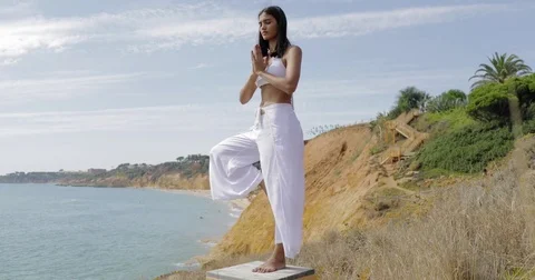 Concentrated woman practicing yoga Stock Footage