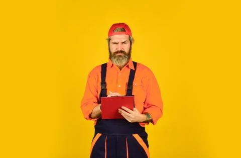Concentrated on work. construction worker holding folder. Structural plan safety Stock Photos
