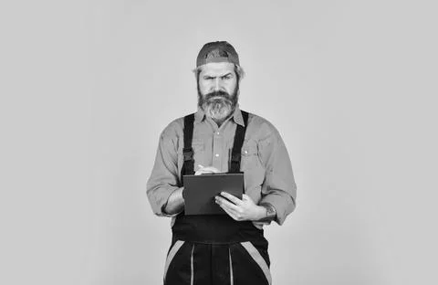 Concentrated on work. construction worker holding folder. Structural plan safety Stock Photos