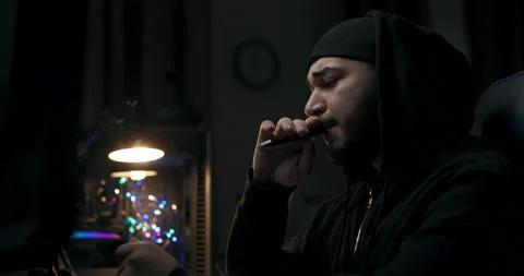 Concentrated on work, guy with beard holds pen. He presses pen nervously and Stock Footage 214719387