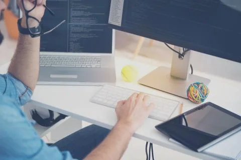 Concentrated on work man coding in an office Foto stock