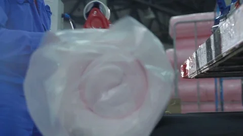 Concentrated Worker Packs Foam Rubber with Adhesive Tape Stock Footage