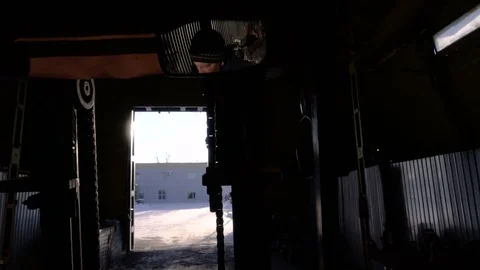 Concentrated worker performs work on the Diesel Forklift Truck. Working in the Stock Footage 75313108