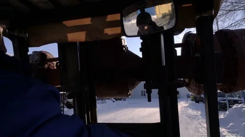 Concentrated worker performs work on the Diesel Forklift Truck. Working in the Stock Footage 75313417