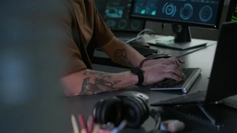 Concentrated Young Male Programmer Working on PC in Modern Programmers Office Stock-Footage 292625572
