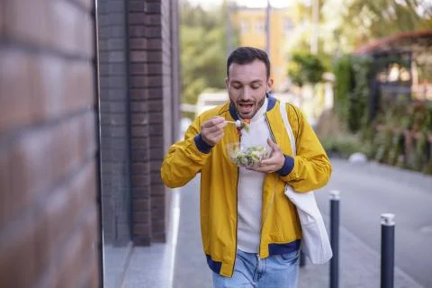 Concentrated young man going quickly to his university Stock Photos