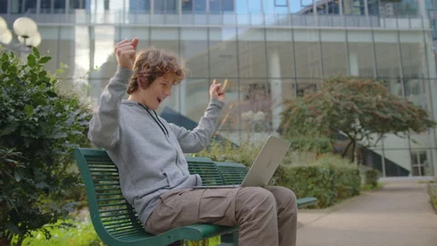 Concentrated young programmer freelancer looking at laptop screen, working Stock Footage 220928341