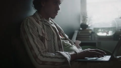 Concentrated Young Programmer Typing on Laptop while Working Remotely Stock Footage 290862950