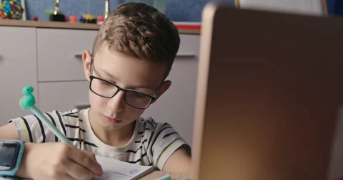 Concentrated Young Student Studying with Laptop in a Home Setting Stock Footage 267375045