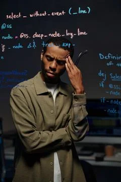 Concentrating on Developing Code in Modern Office Stock Photos