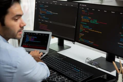 Concentrating IT working software development coding on laptop and pc. Surmise. 스톡 사진