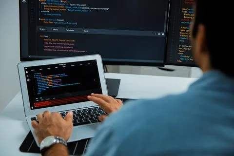 Concentrating IT working software development coding on laptop and pc. Surmise. 스톡 사진