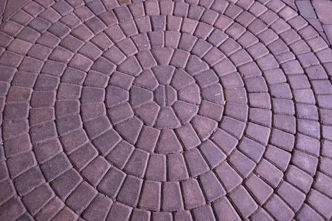 Concentric circles in paver stone brick pattern on patio Foto stock
