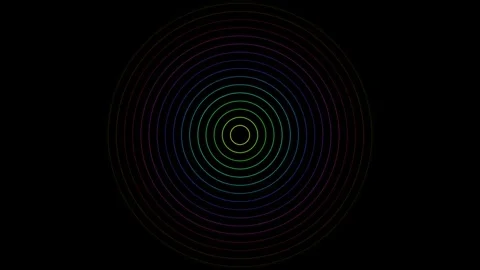 Concentric circles of vibrant rainbow colors set on a deep black background Video stock 335117229