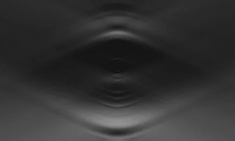 Concentric circular ripples and a central focal point creating a subtle eye.. Stock Photos