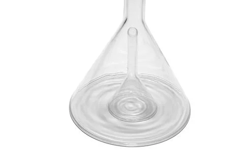 Concentric shadows casts under bigger glass laboratory funnel, which covers.. Stock Photos