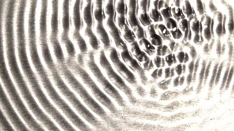 A concentric wave-train grows in complexity. Video stock 144631179