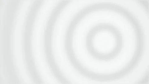 Concentric white and gray ripples expand across a water surface Stock Footage 340831259