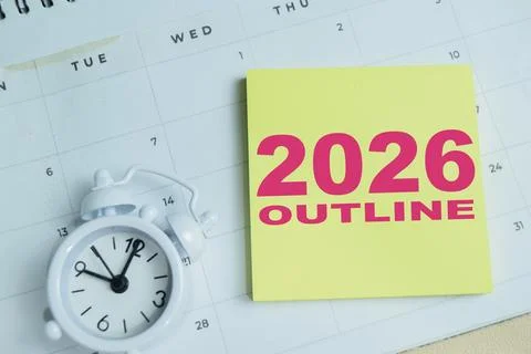 Concept of 2026 outline write on sticky notes isolated on Wooden Table. Stock Photos