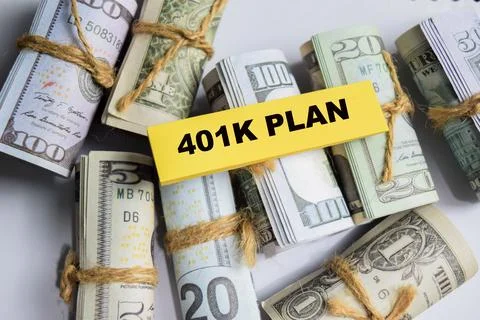 Concept of 401K Plan write on sticky and dollars notes Stock Photos