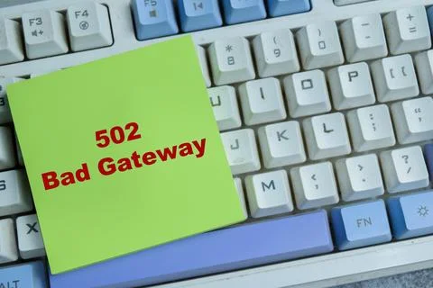 Concept of 502 bad gateway write on sticky notes isolated on Wooden Table. Stock Photos