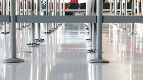Concept of access, restrictions and waiting line. Blocking barriers in airport. Stock Footage
