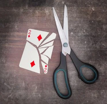 Concept of addiction, card with scissors Stockfoto's