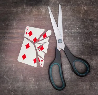 Concept of addiction, card with scissors Fotos de archivo