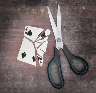 Concept of addiction, card with scissors Stockfoto's