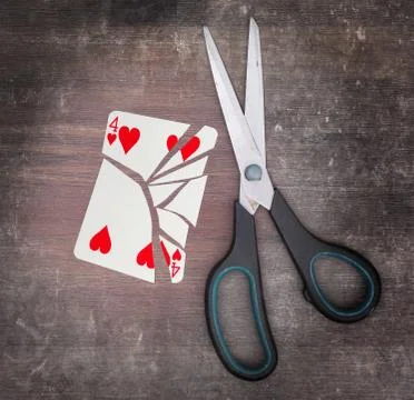 Concept of addiction, card with scissors Stockfoto's