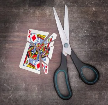 Concept of addiction, card with scissors 스톡 사진