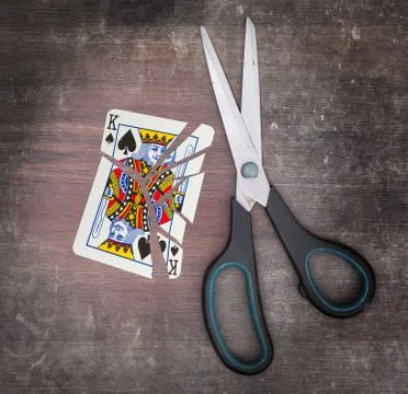 Concept of addiction, card with scissors Stockfoto's