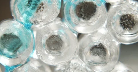 Concept of adding blue curacao syrup to glass of ice. Slow motion video 4K Stock Footage 116158492