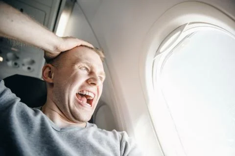 Concept aerophobia. Afraid of fear flying on an airplane and at height Stock Photos