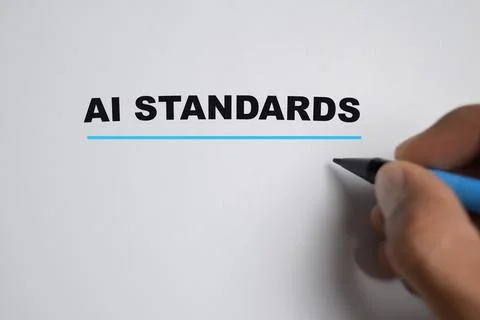 Concept of Ai standards write on book isolated on Wooden Table. Stockfoto's