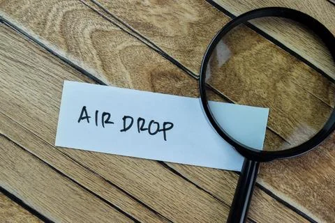 Concept of Air Drop write on sticky notes isolated on Wooden Table. Foto stock
