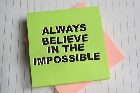 Concept of Always believe in the impossible write on sticky notes Stock Photos