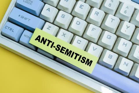 Concept of anti-semitism write on sticky notes isolated on table. Stock Photos
