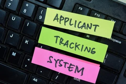 Concept of Applicant tracking System write on sticky notes Fotos Stock