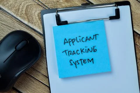 Concept of Applicant Tracking System write on sticky notes Fotos Stock